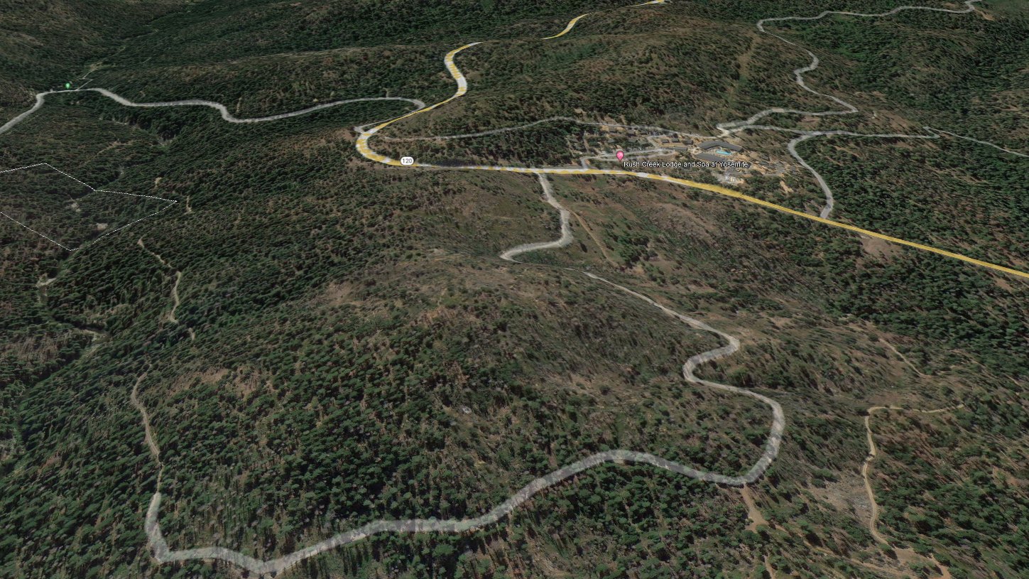Aerial view of the Highway 120 turnout and the Forest Service dirt road switchbacking down toward the claim